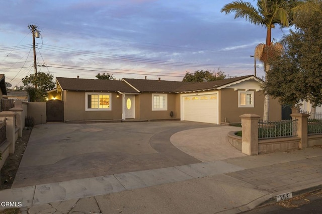 ranch-style home featuring a garage