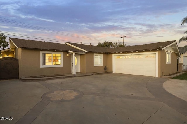 ranch-style house featuring a garage