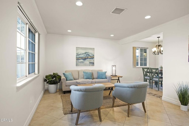 living room featuring light tile patterned floors, a notable chandelier, and ornamental molding