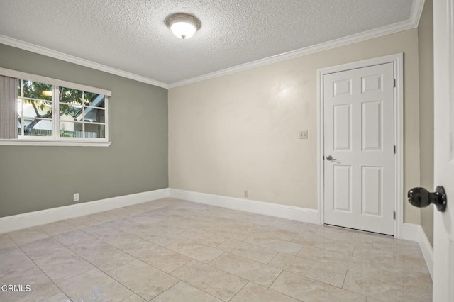 tiled spare room with a textured ceiling and ornamental molding