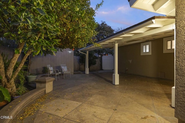 view of patio terrace at dusk