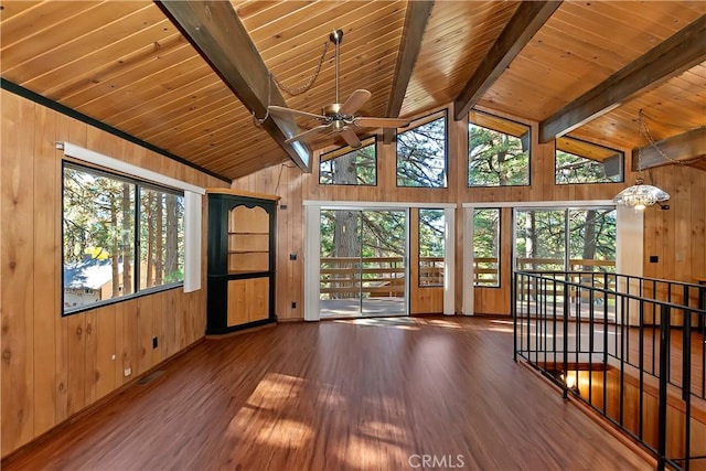 interior space with lofted ceiling with beams, ceiling fan, wooden ceiling, and a wealth of natural light