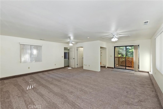 unfurnished living room featuring carpet and ceiling fan