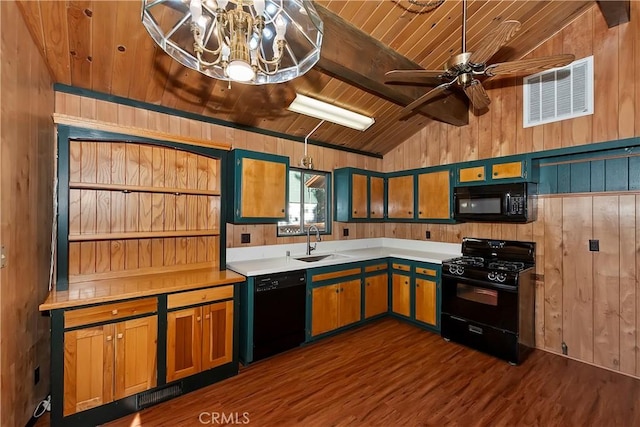 kitchen featuring black appliances, lofted ceiling with beams, wooden walls, ceiling fan, and wood ceiling