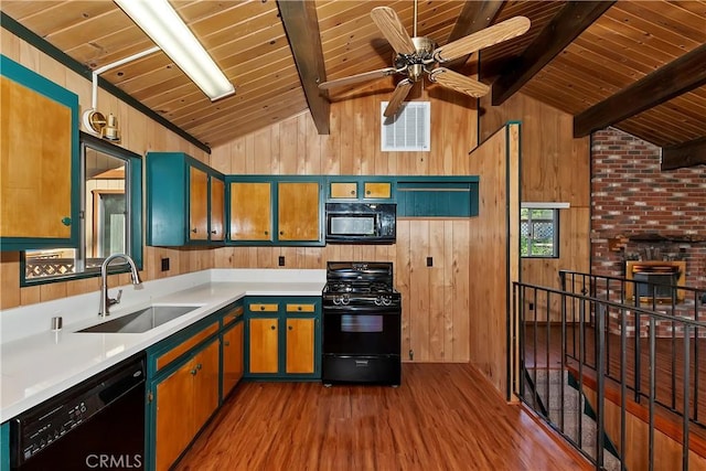 kitchen featuring wood ceiling, sink, beamed ceiling, and black appliances