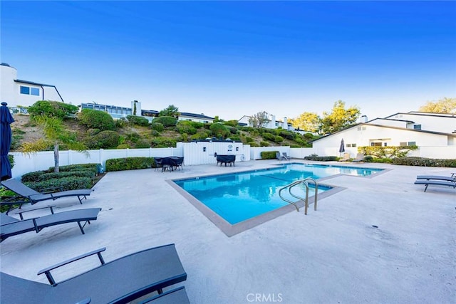 view of pool featuring a patio area