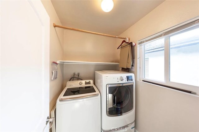 clothes washing area featuring washing machine and dryer