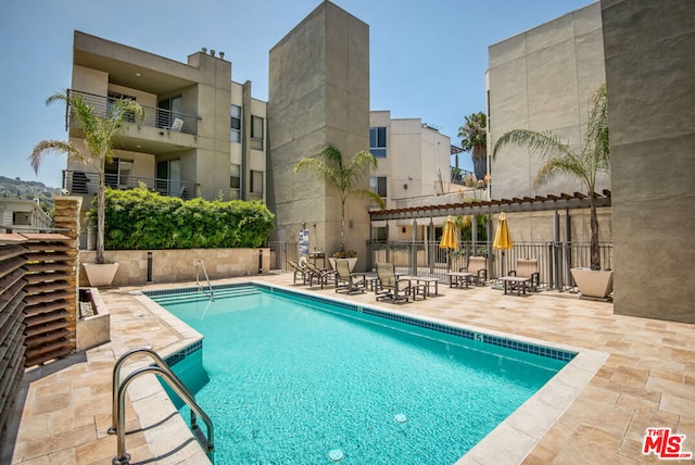 view of swimming pool with a patio area