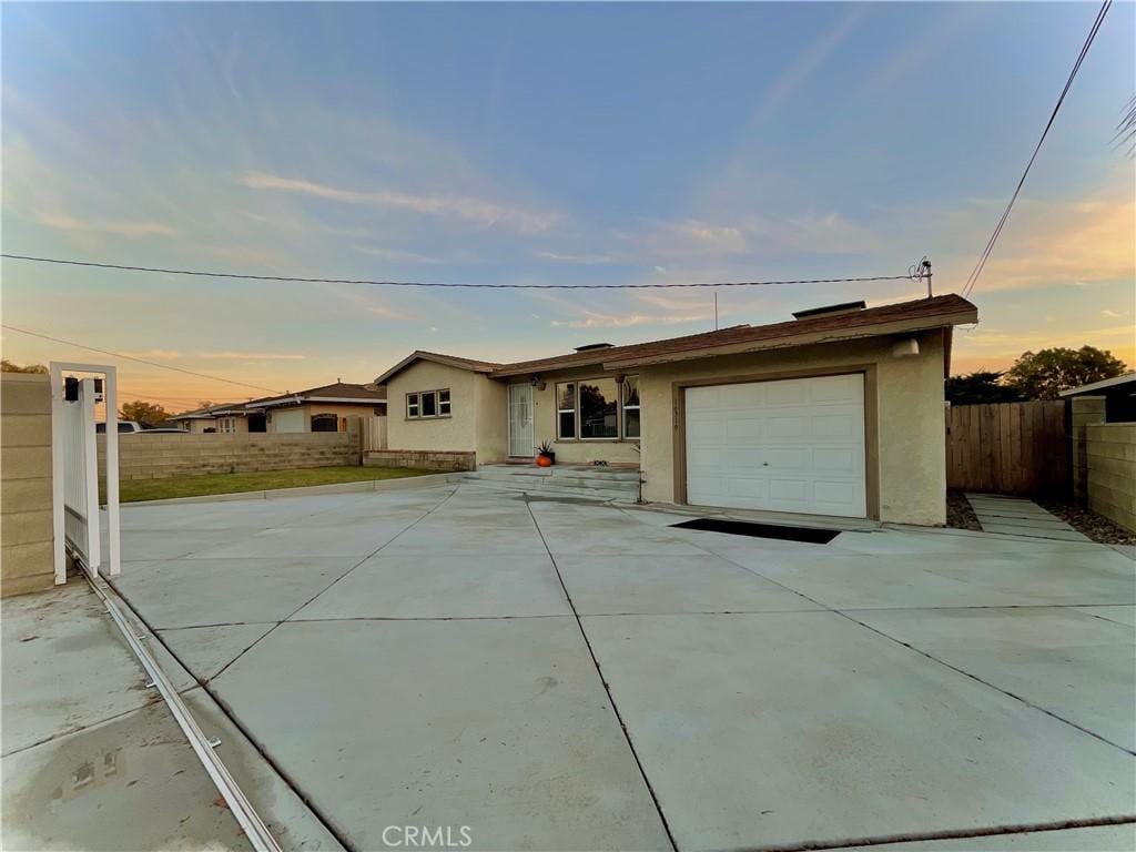 single story home featuring a garage