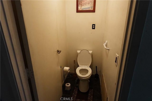 bathroom with tile patterned floors and toilet