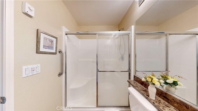 bathroom with a shower with shower door