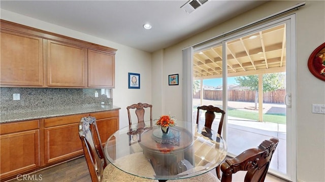 dining room featuring dark hardwood / wood-style flooring