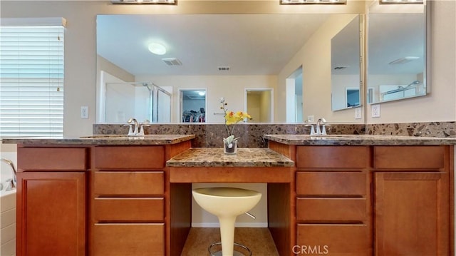 bathroom featuring vanity and separate shower and tub