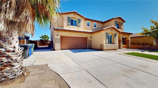 mediterranean / spanish-style house featuring a garage