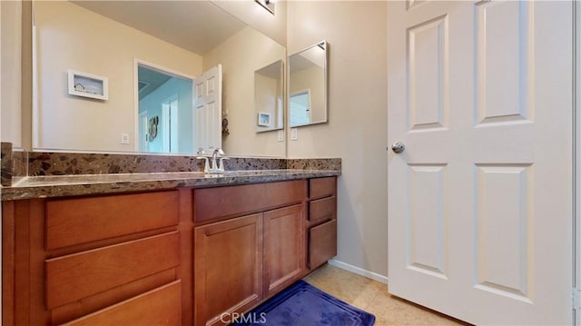 bathroom featuring tile patterned floors and vanity