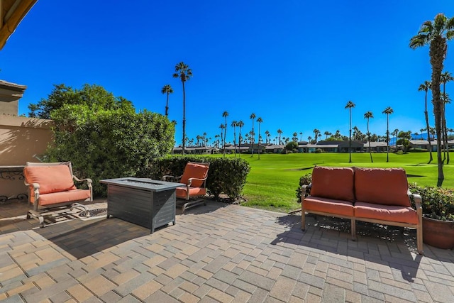 view of patio / terrace with an outdoor fire pit