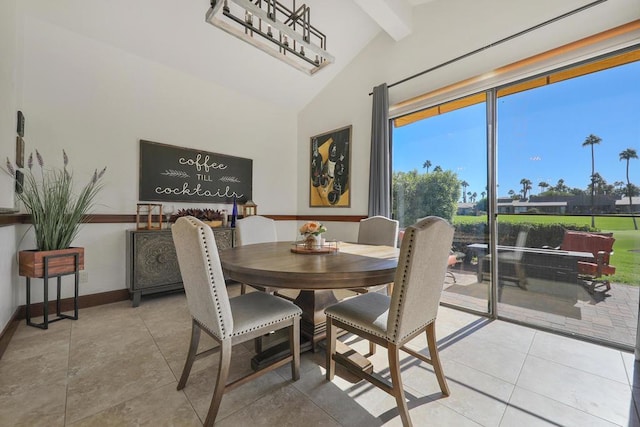 dining space with vaulted ceiling with beams and light tile patterned flooring