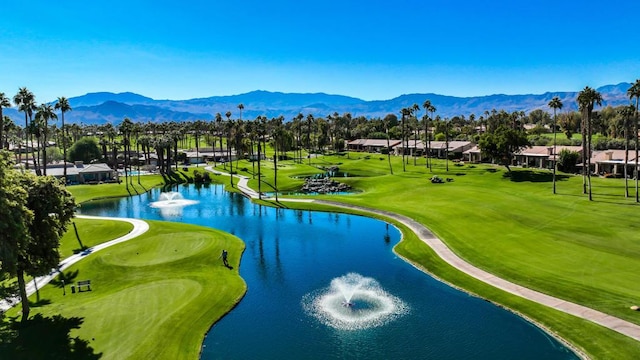 birds eye view of property with a water and mountain view