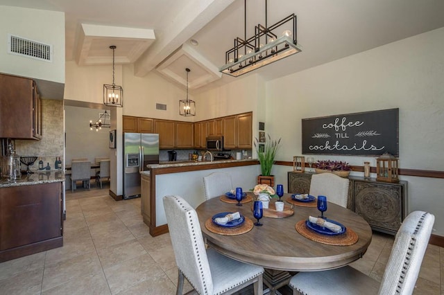 tiled dining area with vaulted ceiling with beams