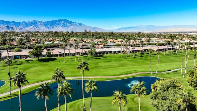 surrounding community with a water and mountain view