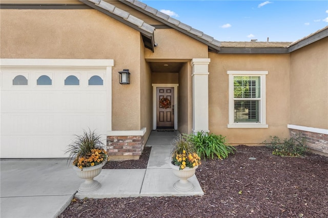 property entrance featuring a garage