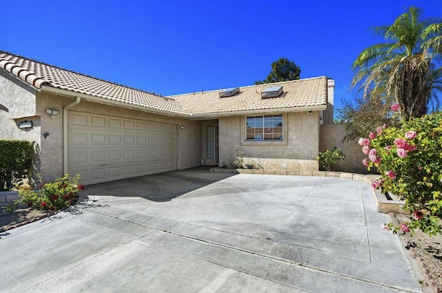 single story home with a garage