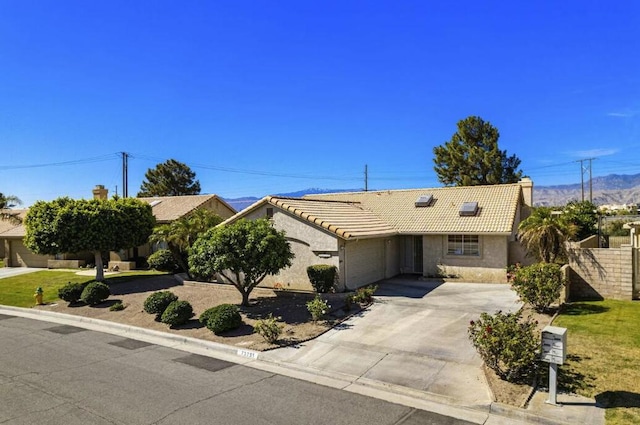 ranch-style home featuring a garage