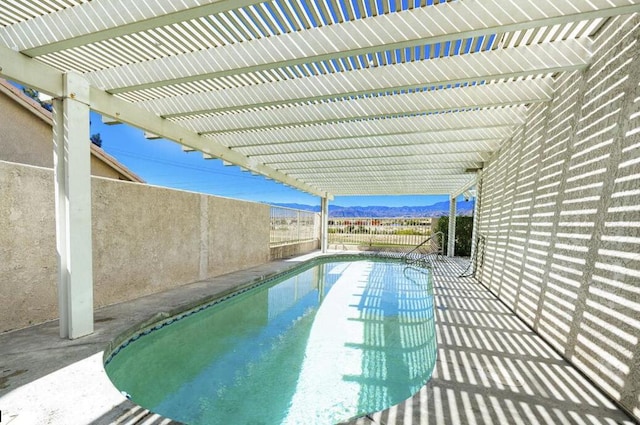 view of swimming pool with a pergola