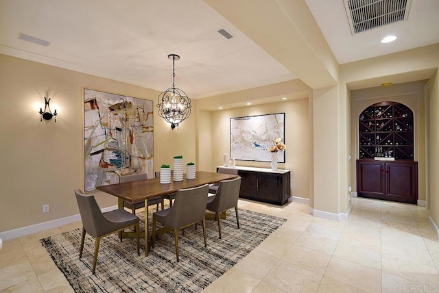 dining space featuring visible vents, crown molding, and baseboards