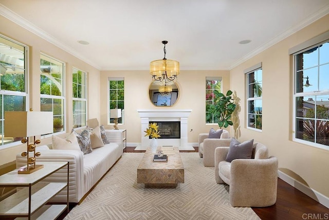 sunroom with a chandelier and a glass covered fireplace