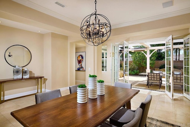 dining area featuring baseboards, visible vents, crown molding, and light tile patterned flooring