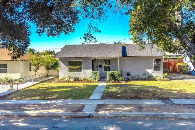 ranch-style home with a front lawn