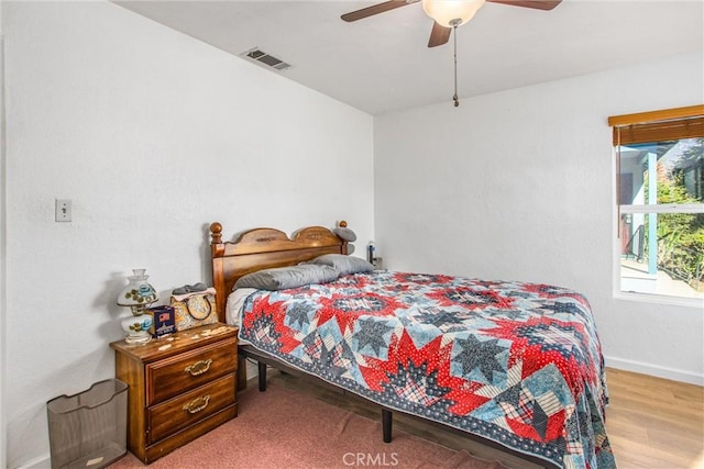 bedroom featuring ceiling fan and light wood-type flooring