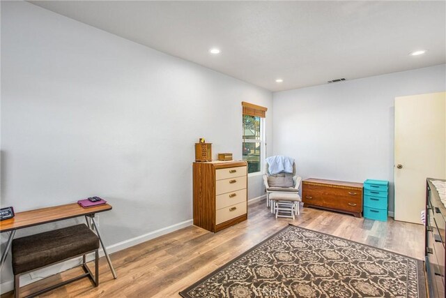 living area with hardwood / wood-style floors