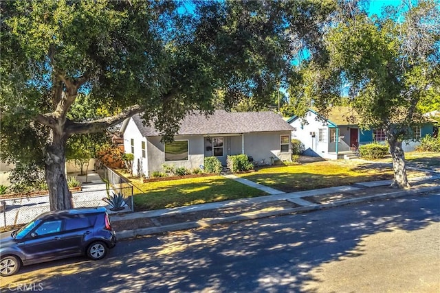 ranch-style home with a front yard