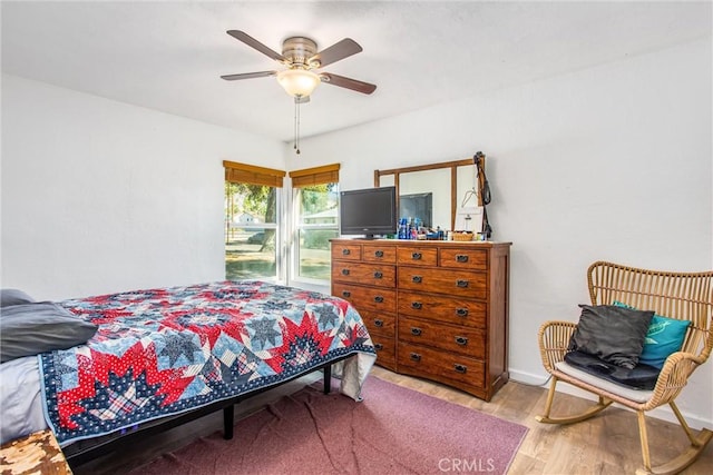 bedroom featuring light wood-type flooring and ceiling fan