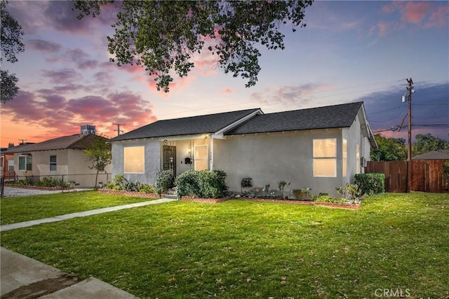 view of front of property with a lawn