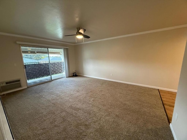 spare room with crown molding, carpet flooring, ceiling fan, and a wall unit AC