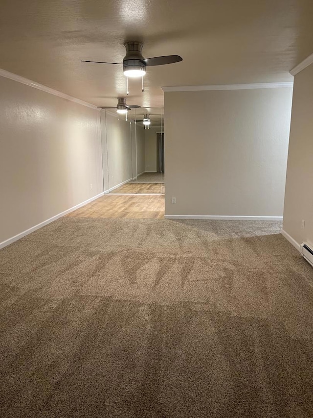 carpeted empty room with crown molding and ceiling fan