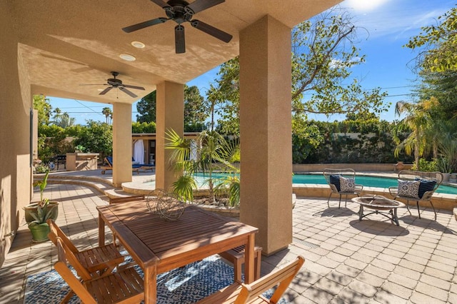 view of patio featuring ceiling fan and exterior kitchen