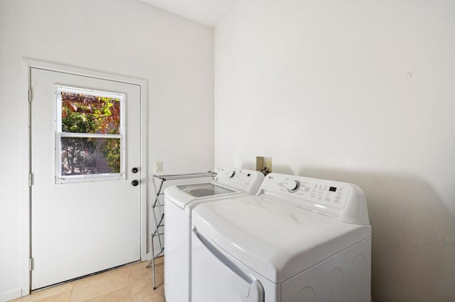 laundry room with light tile patterned flooring and independent washer and dryer