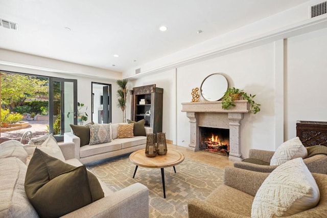 living room featuring a premium fireplace