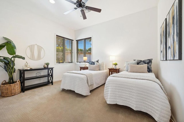 bedroom featuring ceiling fan and light colored carpet