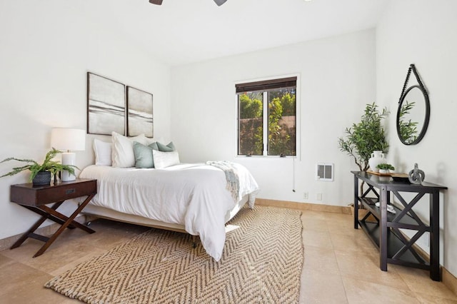 tiled bedroom featuring ceiling fan