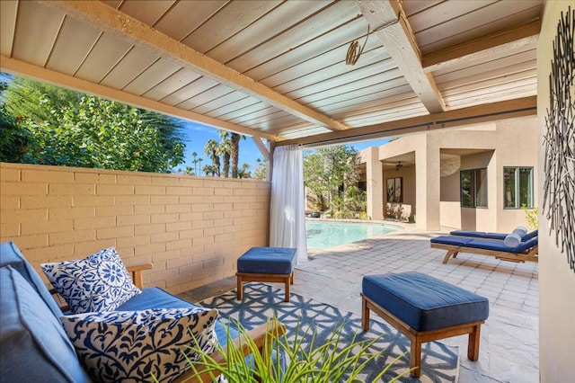 view of patio / terrace with a fenced in pool and an outdoor living space