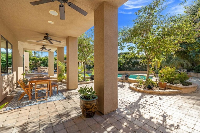 view of patio featuring ceiling fan