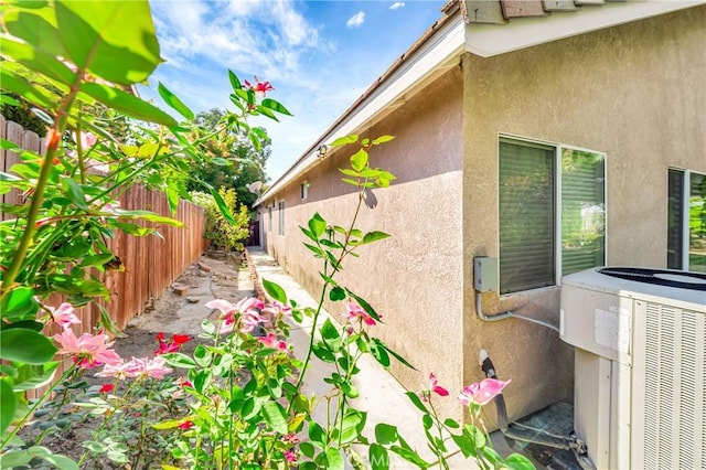 view of side of property with cooling unit