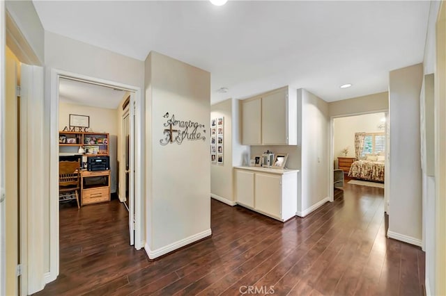 corridor featuring dark hardwood / wood-style floors