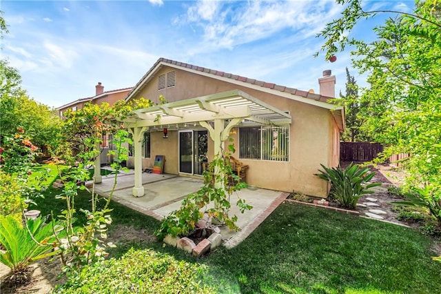 back of house featuring a pergola and a patio area