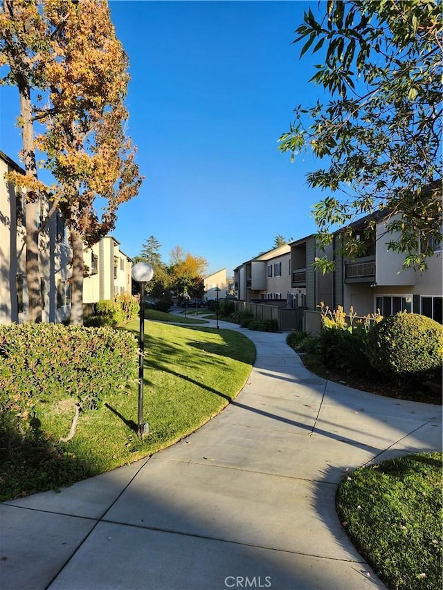 view of home's community with a lawn